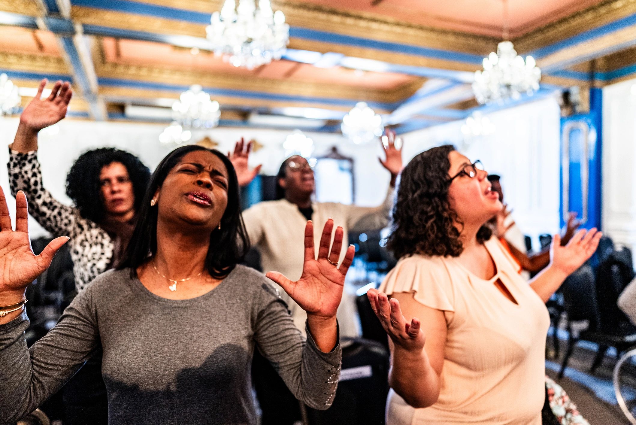 Woman engaged in heartfelt worship during a church service
